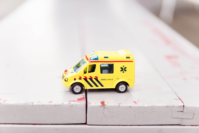 toy ambulance wooden surface